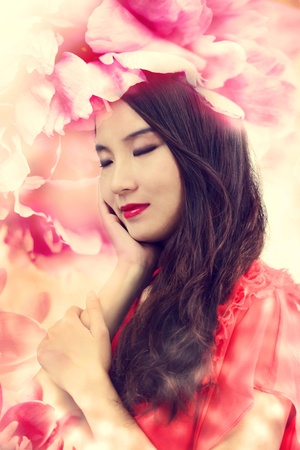 Beautiful Girl in Elegant Flowersの写真素材