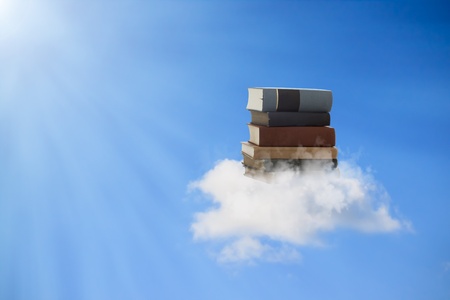 Beautiful books floating on a cloud (concepts of reading, education, knowledge enlightenment)の写真素材