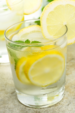 Fresh Lemonade in a Glass with Lemon Slices の写真素材