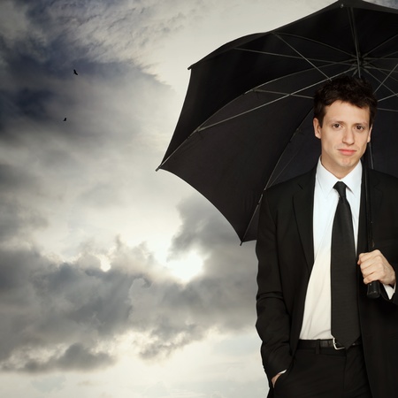 Portrait of a Young Stylish Business Man with Umbrellaの写真素材