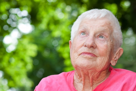 Senior Woman in a Wheelchair Looking upの写真素材