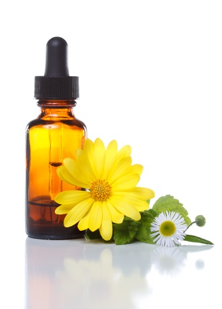 Herbal medicine dropper bottle with flowersの写真素材