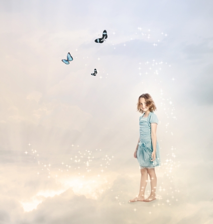 Girl in the Clouds with Butterfliesの写真素材