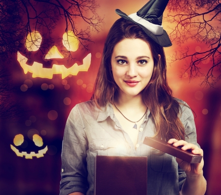 Halloween Cute Witch Opening a Boxの写真素材