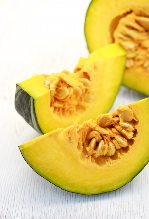 Kabocha pumpkin  on white wooden boardの写真素材
