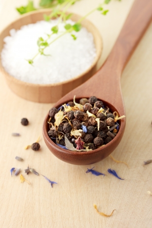 Peppercorn with salt and thyme on cutting boardの写真素材