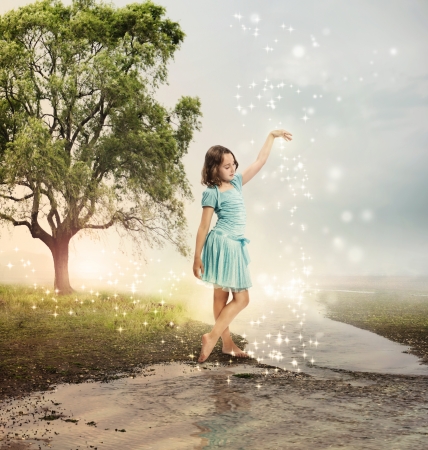Little Girl at a Shining Brook with Starsの写真素材