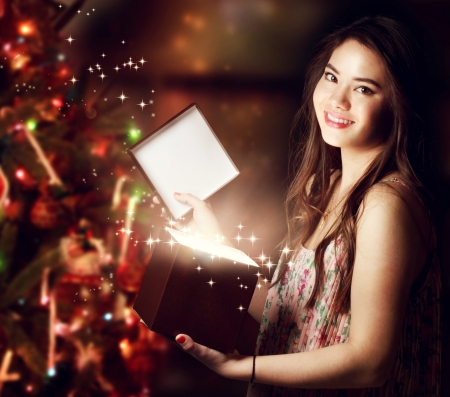 Happy Girl Opening a Gift Boxの写真素材