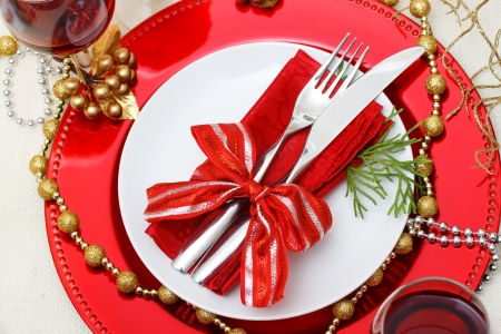 Christmas plate and silverware with red wineの写真素材