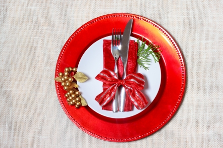 Christmas plates and silverware on burlapの写真素材