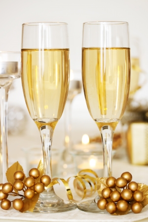 Two champagne glasses on the dinner tableの写真素材