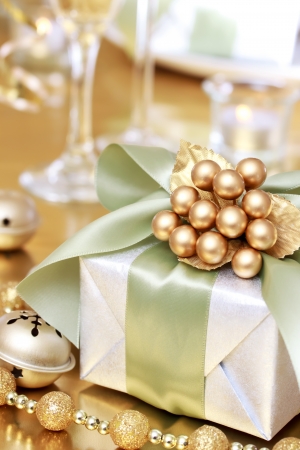 Christmas Gift Box on the Dinner Tableの写真素材