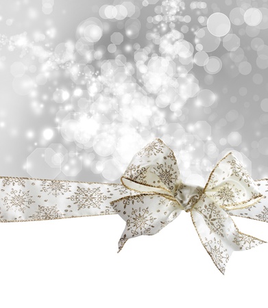 White Snowflake Bow and Ribbon with Bokeh Lights Background の写真素材