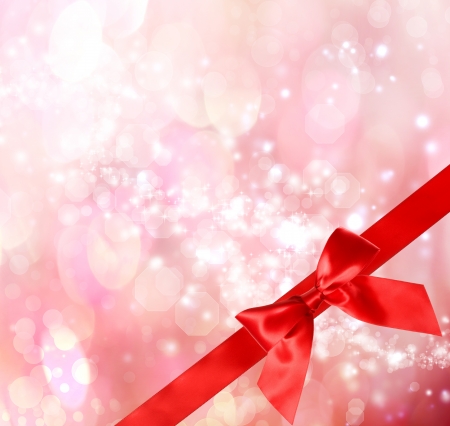 Red Bow and Ribbon with  Pink Bokeh Lights Background の写真素材