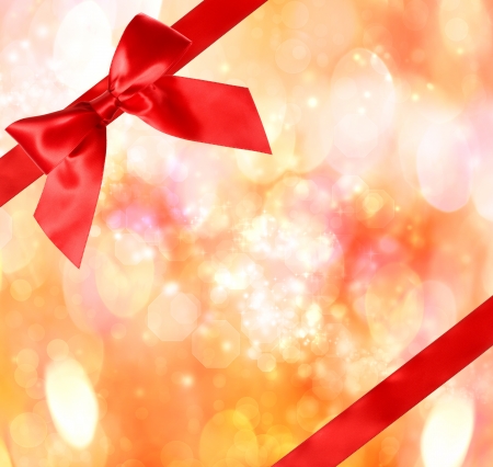 Red Bow and Ribbon with Bokeh Lights Background の写真素材