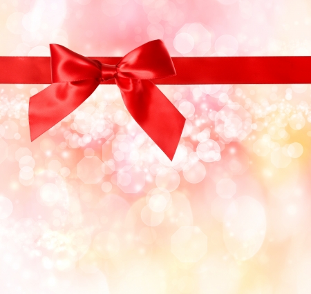 Red Bow and Ribbon with  Pink Bokeh Lights Background の写真素材