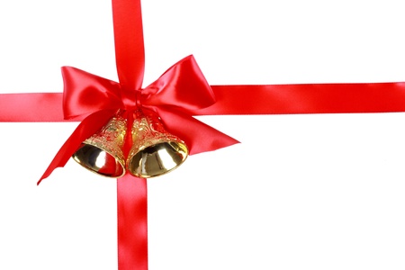 Red Christmas ribbon with bells over white backgroundの写真素材