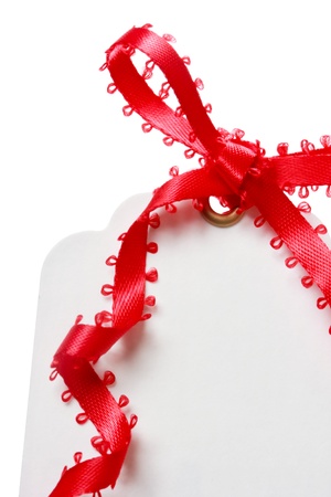 Price Tag with Red Ribbon on White Backgroundの写真素材