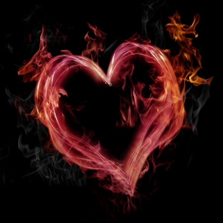 Flaming pink heart on black backgroundの写真素材