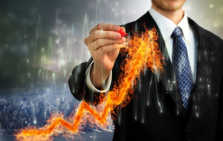 Businessman with a Flaming arrow indicating growthの写真素材