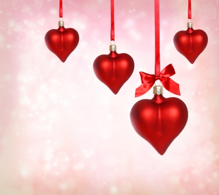 Valentine heart ornaments with pink light backgroundの写真素材