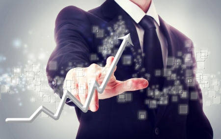 Businessman Touching a Arrow Indicating Growth の写真素材