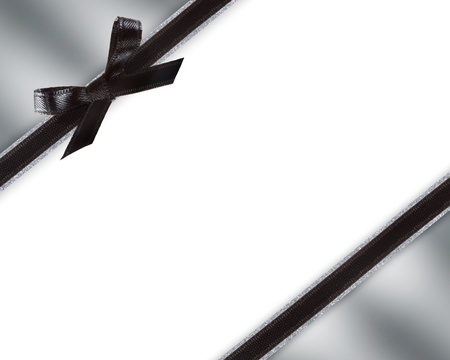 Black Bow and Ribbon with Metallic Silver and White Backgroundの写真素材