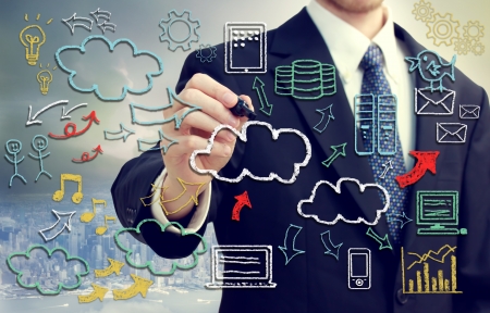 Businessman with hand written cloud computing themed texts and picturesの写真素材