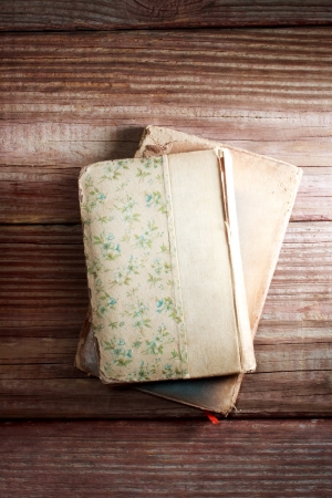 Antique books sitting on a vintage wood table の写真素材