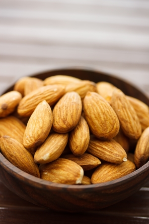 Almonds in wooden bowlの写真素材