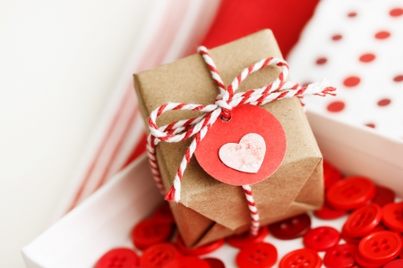 Handmade small gift box with heart tag and twine cordsの写真素材