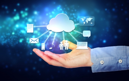 Cloud computing connectivity concept being held in a one persons hand on blue technology backgroundの写真素材