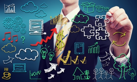 Businessman with hand written cloud computing themed texts and pictures の写真素材