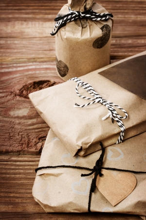 Hand crafted gifts on rustic wooden tableの写真素材