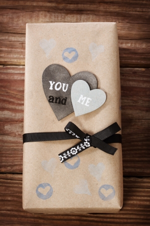Hand crafted love appreciation present box on rustic wooden tableの写真素材