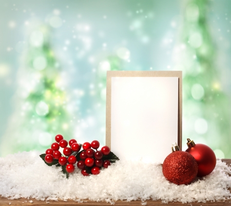 Message card with red ornaments over Christmas tree の写真素材