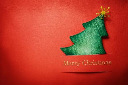 Handmade paper craft Christmas tree with Merry Christmas textの写真素材