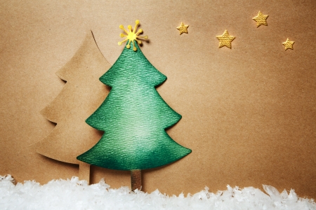 Handmade paper craft Christmas tree and snow with starsの写真素材