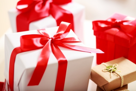 Red, white and earthy colored gift boxesの写真素材