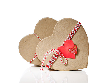 Heart shaped gift boxes with heart tags isolated on white backgroundの写真素材