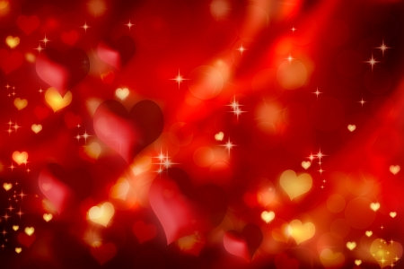 Red and golden hearts on gradient backgroundの写真素材