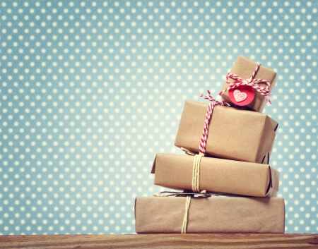 Handmade gift boxes over green polka dots backgroundの写真素材