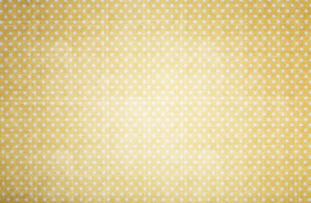 yellow polka dots paper in grunge styleの写真素材
