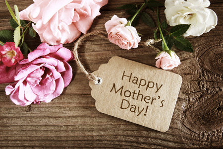 Mothers day card with rustic roses on wooden boardの写真素材