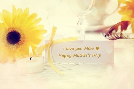 Mothers Day table setting with yellow gerberasの写真素材