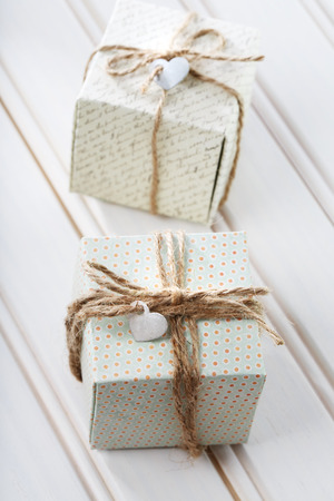 Handmade small present boxes with heart shaped tagsの写真素材