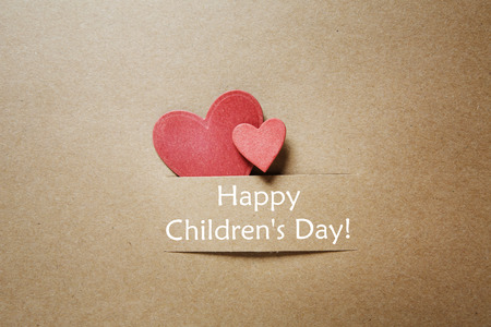 Childrens day message with handmade red paper heartsの写真素材