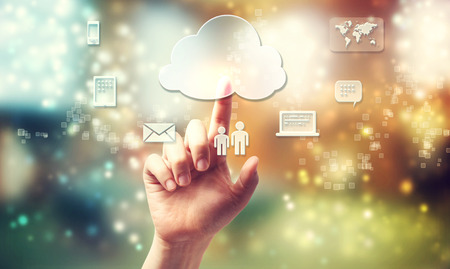 Cloud computing theme with person pushing cloud buttonの写真素材