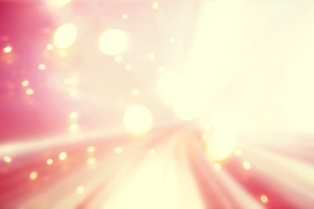 Pink colored abstract shiny light tunnel backgroundの写真素材