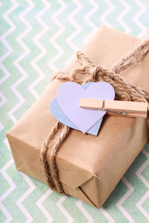 Handmade gift box with purple and blue hearts in rustic styleの写真素材